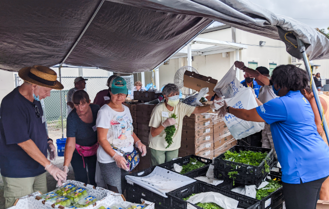 Volunteers packing produce