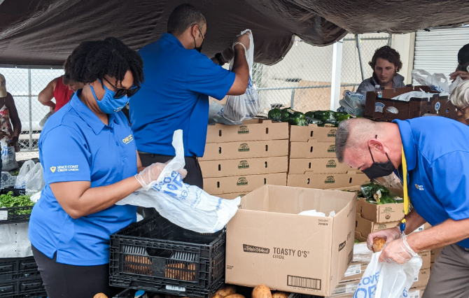 Volunteers packing produce